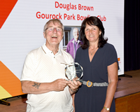 Active Schools Sports Development Volunteer Awards 2023. Councillor Sandra Reynolds presenting a trophy to winner Douglas Brown.